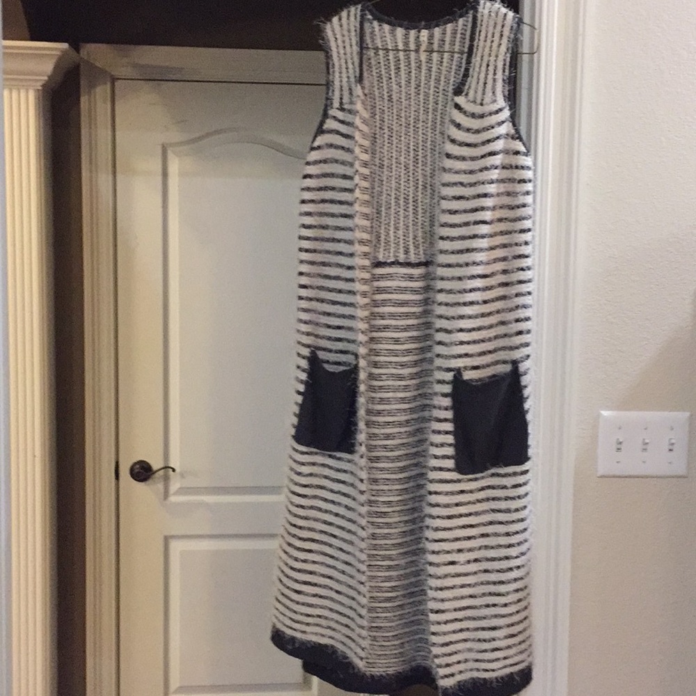 Long sleeveless cardigan in excellent condition.
